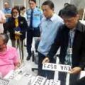 Transport officials inspect new local license plate manufacturing facility image