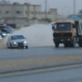 Saudis drifting with executive cars and assault rifles image