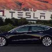 First production Tesla Model 3 unit unveiled, goes to Elon Musk image