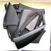 This sculpture is made of scrap body panels from Toyota Otis image