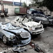 Ten smuggled cars meet crushing end at Port of Manila, Cebu image