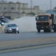 Saudis drifting with executive cars and assault rifles image