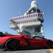 Lamboghini Veneno Roadster makes public debut aboard aircraft carrier image