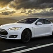 Tesla launches battery swap pilot program image