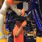 Ford experimenting with robots on production line image