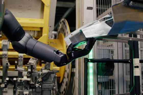 BMW testing intelligent humanoid robot factory workers image