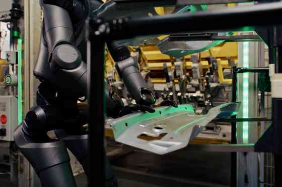 BMW testing intelligent humanoid robot factory workers image