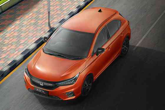We want the Honda City Hatchback RS in Phoenix Orange Pearl image