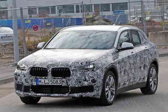 BMW announces plan to launch over 40 models in two years image