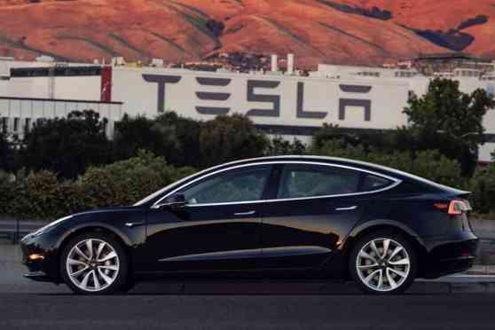 First production Tesla Model 3 unit unveiled, goes to Elon Musk image