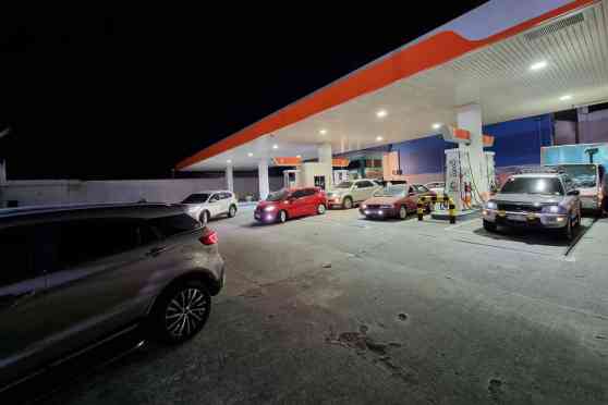 Panic buying: Motorists queue last night before huge price increase today image