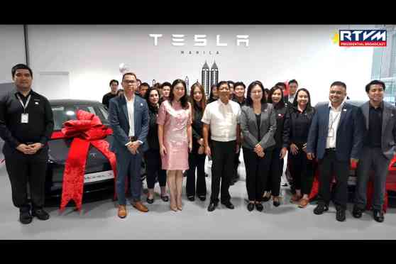 PBBM visits the Tesla storefront in BGC image