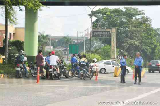 Aquino signs law banning small children riding on motorbikes in public Aquino signs law banning small children riding on motorbikes in public image