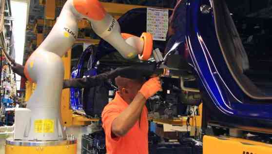 Ford experimenting with robots on production line image