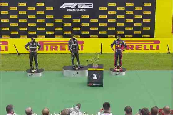 There's an R/C car underneath F1's trophy delivery robot image
