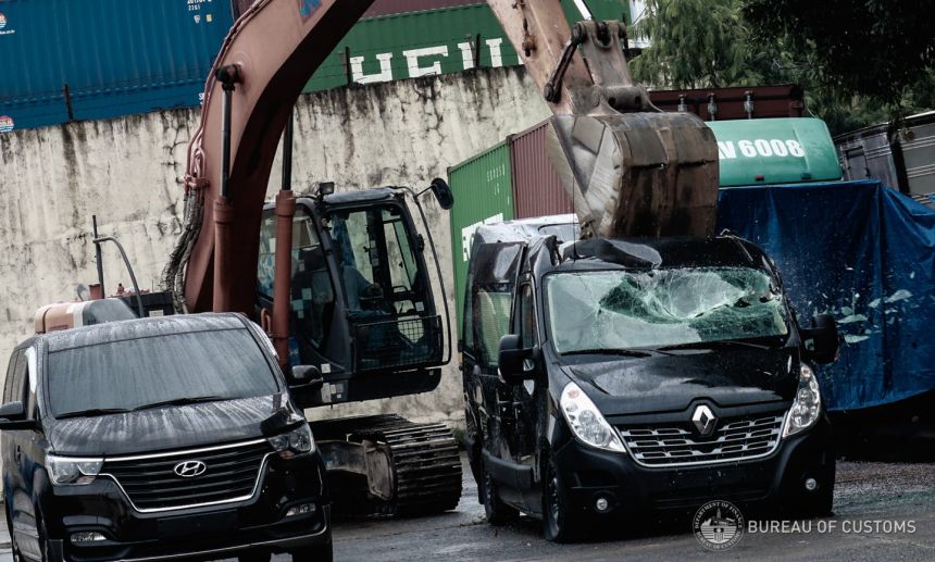 Ten smuggled cars meet a crushing end at Port of Manila, Cebu image