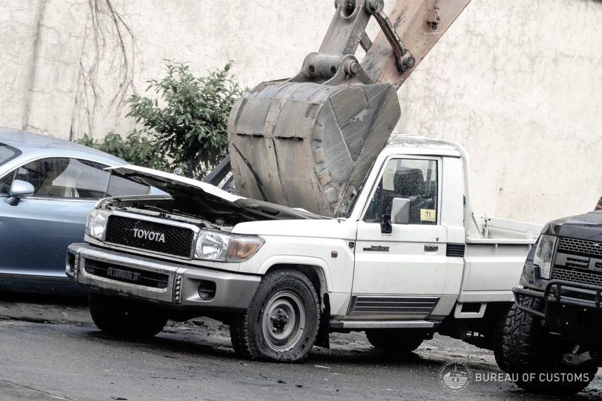 Ten smuggled cars meet a crushing end at Port of Manila, Cebu image