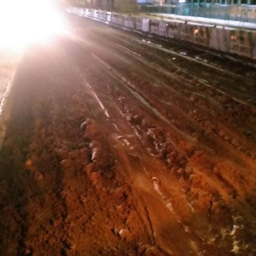 MMDA was busy cleaning up a lot of mud on EDSA image