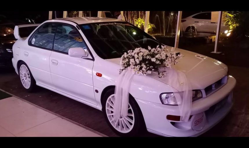 You can rent this Subaru Impreza STI as your wedding car image