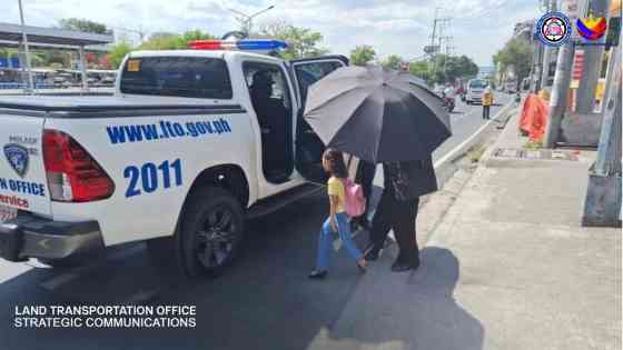 Stranded commuters get free lift from LTO patrol cars Stranded commuters get free lift from LTO patrol cars image