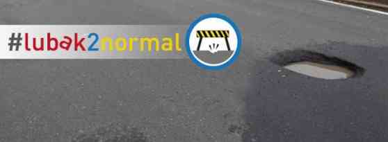 DPWH urges public to report roads damaged due to rain via twitter DPWH urges public to report roads damaged due to rain via twitter image