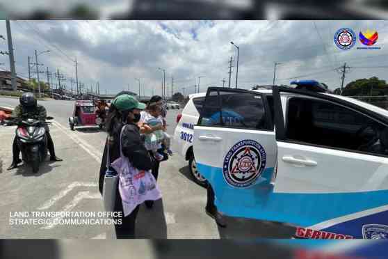 Stranded commuters get free lift from LTO patrol cars Stranded commuters get free lift from LTO patrol cars image