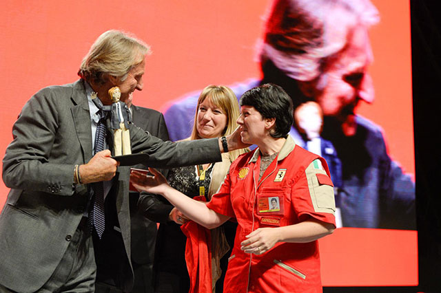 A Ferrari worker gives a gift to Montezemolo