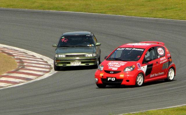BYD F0 race car duels with a Toyota Corolla