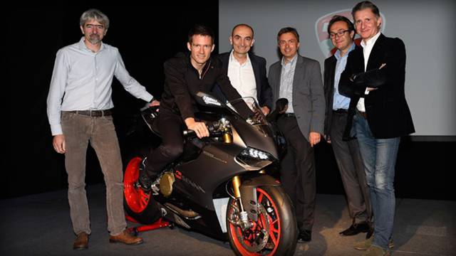 Sebastien Ogier receiving the Ducati bike
