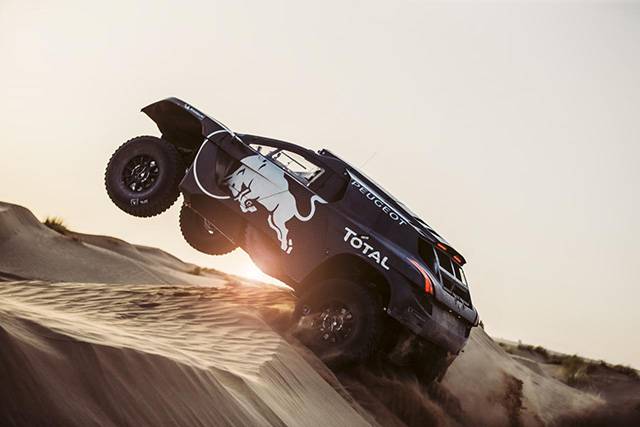 The 2008 DKR16 climbing up a sand dune