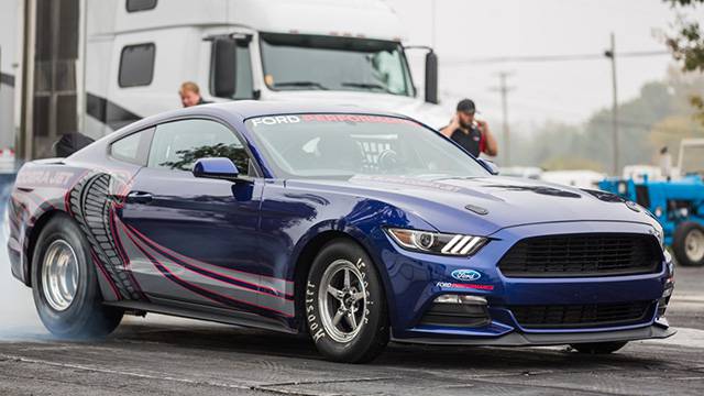 The Mustang Cobra Jet burning some rubber in a drag strip