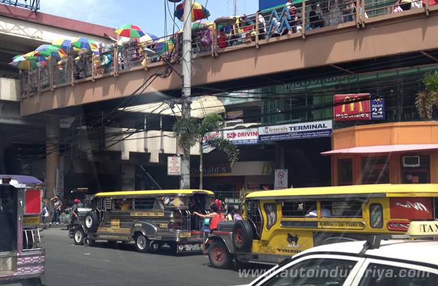 Jeepney loading passengers in No Loading/Unloading zone