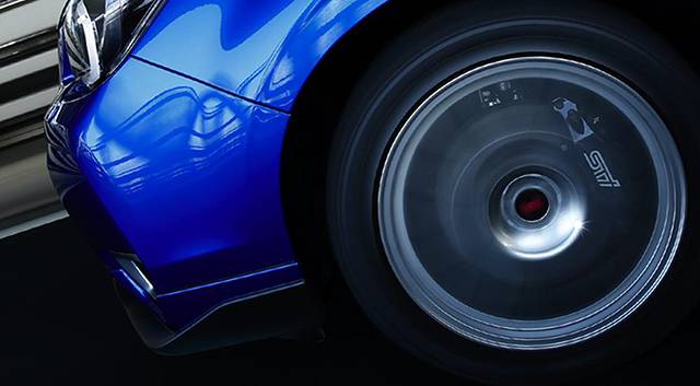 The STI branded brake calipers and alloy wheels