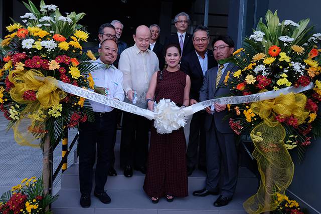 The cutting of the ribbon at Mazda Sta. Rosa