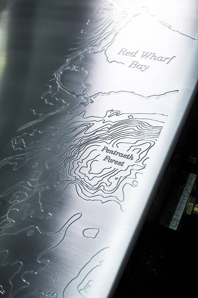 The map of Red Wharf Bay engraved on the aluminum fender