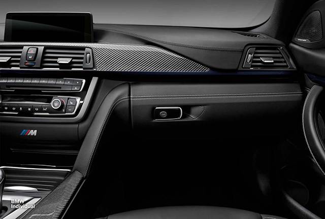 The dashboard and center console of the BMW Individual M4 Coupe 25th anniversary