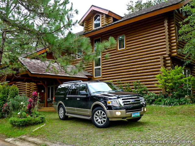 Log cabin amidst the pine trees