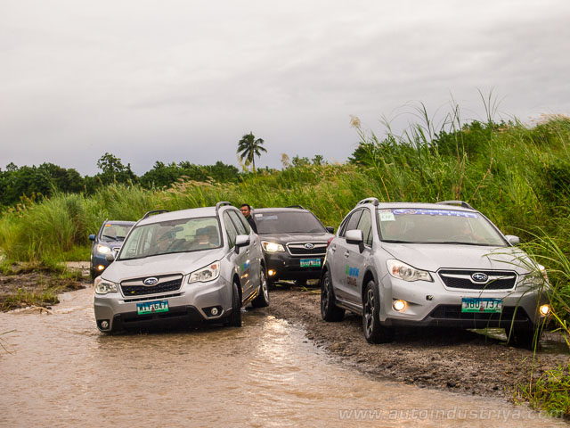 Subaru XVs and Foresters by the riverbed