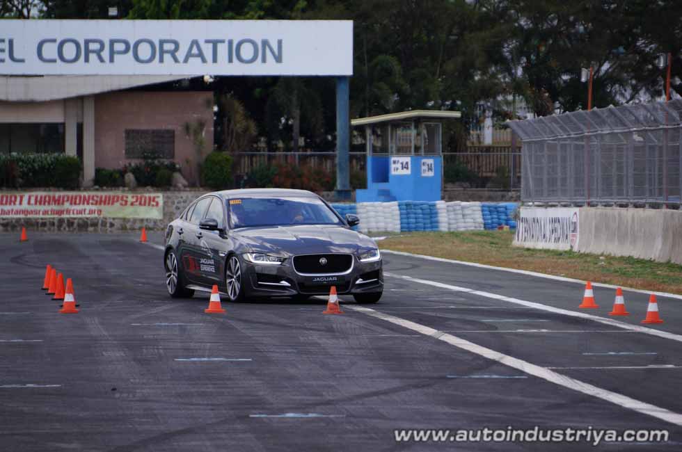 A Jaguar XE saloon goes through the lane-change exercise