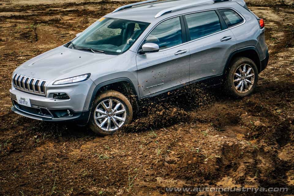 The Jeep Cherokee kicking up some mud