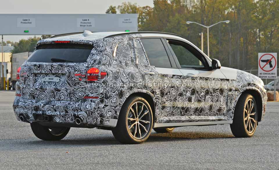 Rear quarter of the camo'd next-gen BMW X3 