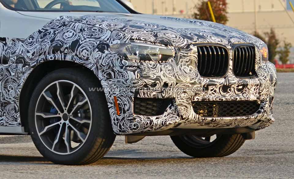 The front fascia of the next-gen BMW X3 camo'd