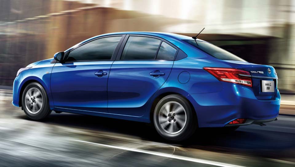 The Toyota Yaris-L Sedan from behind